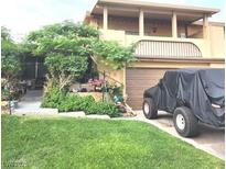 Charming two-story house with mature trees and covered parking at 508 Tara Ct, Boulder City, NV 89005
