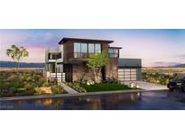 Stunning contemporary home featuring modern architecture, sleek lines, and a beautifully landscaped front yard at 523 Overlook Rim Dr, Henderson, NV 89012
