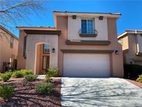 Charming two-story home showcasing a well-manicured front yard and a spacious two-car garage at 533 Via Santiago St, Las Vegas, NV 89144