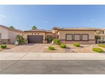 Charming single story home with a desert landscape, brick driveway, and covered entry at 5576 Buena Martina Way, Las Vegas, NV 89141