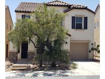 Charming two-story home featuring desert landscaping and a one car garage at 5941 Alington Bend Dr, Las Vegas, NV 89139