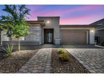 Charming single-story home with desert landscaping, stone accents, and a spacious two-car garage at 6684 Regency Stone Way, Las Vegas, NV 89148