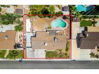 Aerial view of a single-Gathering home with a pool, large yard, and RV parking at 6710 Rocking Horse Ave, Las Vegas, NV 89108