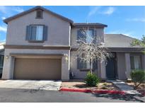 Charming two-story home featuring a two-car garage and desert landscaping at 6804 Tropicaire St, Las Vegas, NV 89149