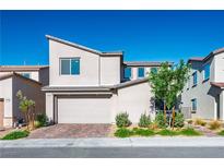 Modern two-story home with a two-car garage and a well-manicured front yard at 9476 Lunar Phase St, Las Vegas, NV 89143