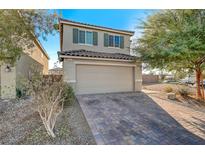 Charming two-story home with a quaint front yard and a two-car garage at 1317 Hopespring Loop Ave, North Las Vegas, NV 89084