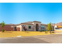 Charming single-story home with stone accents and a well-maintained yard, perfect for suburban living at 211 E Kimberly Dr, Henderson, NV 89015