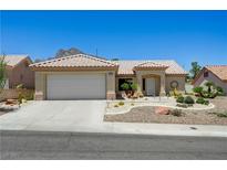 Charming single-story home with a two-car garage, desert landscaping, and a tiled roof at 2545 Banora Point Dr, Las Vegas, NV 89134