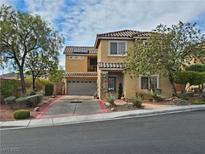 Charming two-story home with well-maintained landscaping and inviting curb appeal in a desirable neighborhood at 2691 Benton Cove St, Laughlin, NV 89029