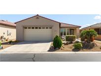Charming single-story home featuring a two-car garage, desert landscaping and well maintained lawn at 3621 Jasmine Heights Ave, North Las Vegas, NV 89081