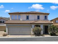 Charming two-story home with a well-maintained front yard and a two-car garage and tile roof at 3961 Bayamon St, Las Vegas, NV 89129