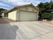 Charming single-story home with a two-car garage and a well-maintained concrete driveway at 4113 Arcola Ave, Las Vegas, NV 89110