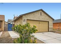 Charming one-story home featuring a two-car garage and desert-friendly landscaping at 4611 Four Leaf Clover Dr, Las Vegas, NV 89122
