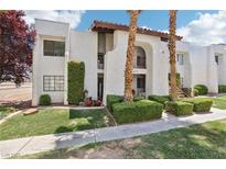 Inviting two-story condo with well-maintained landscaping and desert-friendly design at 5063 Eldora Ave # 4, Las Vegas, NV 89146