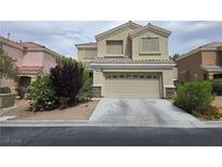 Inviting two-story home with a two-car garage and neutral stucco exterior, located in a well-maintained neighborhood at 6638 Babys Tear Pl, Las Vegas, NV 89148