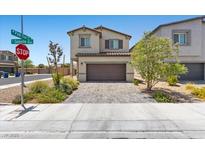 Charming two-story home with a brick driveway and well-maintained landscaping at 8261 Selenite St, Las Vegas, NV 89113