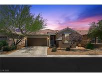 Charming single-story home featuring a well-maintained yard and attached two-car garage in a desirable community at 9104 Ashiwi Ave, Las Vegas, NV 89178