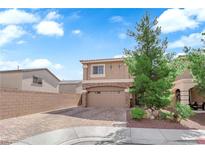 Charming two-story home featuring a brick driveway and a well-maintained front yard with mature trees at 9604 Stoney Mesa Ct, Las Vegas, NV 89139