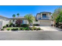 Charming two-story home featuring a well-manicured lawn and a two car garage at 10249 Wisteria Hills Ct, Las Vegas, NV 89135