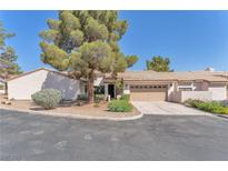 Charming single-story home featuring a low-pitched tile roof, desert landscaping, and a two-car garage at 1951 Moyer Dr, Henderson, NV 89074