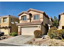 Traditional two-story home with a two car garage and well maintained lawn at 224 Wicked Wedge Way, Las Vegas, NV 89148
