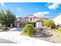 Charming two-story home with a well-manicured lawn and an attached two-car garage at 2608 Campobello Ave, North Las Vegas, NV 89081