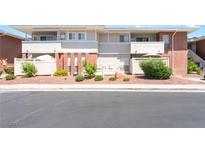 Inviting condo featuring a well-maintained exterior with red rock landscaping and quaint, fenced-in patio area at 2866 Loveland Dr # 2018, Las Vegas, NV 89109