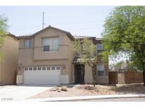 Charming two-story home featuring a two-car garage and a well-maintained yard, creating a welcoming curb appeal at 3309 Conterra Park Ave, North Las Vegas, NV 89081