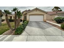 Charming single-story home with desert landscaping and a two-car garage at 4713 Vista Del Rey Ct, North Las Vegas, NV 89031