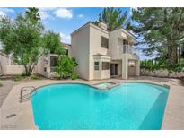 Inviting backyard pool and spa with lush landscaping in a beautiful setting at 5205 Coral Glow Ct, Las Vegas, NV 89149