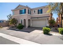 Inviting two-story home with a two-car garage and well-maintained landscaping, curb appeal at 6121 Mission Gorge Ct, Las Vegas, NV 89130