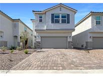 Charming two-story home featuring a two-car garage and beautiful brick driveway in a well-kept community at 6918 Dandelion Park Ave, Las Vegas, NV 89113