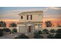 Charming two-story home with stone accents, desert landscaping, and a cozy, inviting facade at sunset at 83 Cashmere Waltz Pl, Henderson, NV 89011