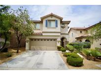 Charming two-story home featuring a well-maintained yard and attached two-car garage in a suburban neighborhood at 9144 Clear Sky Ave, Las Vegas, NV 89178