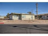 Charming single-story home featuring a fenced yard and well-maintained landscaping at 103 W Victory Rd, Henderson, NV 89015