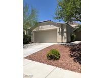Charming single-story home with desert landscaping and a two-car garage on a sunny day at 10342 Spider Rock Ave, Las Vegas, NV 89135