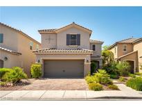 Inviting two-story home featuring a two-car garage and a well-maintained front yard at 1433 Overseer Ave, Henderson, NV 89074