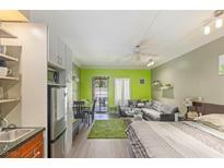 Bright open floor plan featuring dining, living, and sleeping areas with a private balcony at 30 Strada Di Villaggio # 429, Henderson, NV 89011