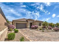 Beautiful single-story home featuring a tile roof, desert landscaping, and a spacious driveway at 3486 Molinos Dr, Las Vegas, NV 89141