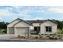 Beautiful single-story home showcasing a three-car garage and low-maintenance landscaping at 489 Carter House Way, Las Vegas, NV 89138