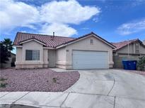 Charming single story home featuring a two car garage and low maintenance desert landscaping at 5217 Yellow Dawn Ct, Las Vegas, NV 89130