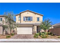 Charming two-story home with a well-manicured front yard and a two-car garage at 7045 Judith River St, North Las Vegas, NV 89084