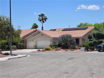 Charming single-story home with a terracotta roof, desert landscaping, and a two-car garage at 8777 Shady Peak Way, Las Vegas, NV 89123