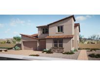 Charming two-story home boasts a tile roof, desert landscaping and neutral color palette at 9314 Observatory St, Las Vegas, NV 89143