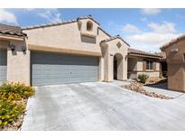 Charming single-story home with a two-car garage and inviting desert landscaping at 9393 New Utrecht St, Las Vegas, NV 89178