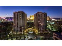 Stunning nighttime aerial view of the luxury high rise condos with city and High Roller Observation Wheel views at 1 Hughes Center Dr # 308, Las Vegas, NV 89169