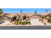 Charming single-story home with desert landscaping, stucco walls, tile roof, and two-car garage at 1309 Vista Del Monte Dr, Mesquite, NV 89027