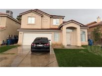 Charming two-story home featuring a two-car garage and well-maintained front yard at 1749 Green Apple Way, Las Vegas, NV 89142
