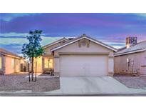Charming single-story home featuring a two-car garage and desert landscaping in a quiet neighborhood at 2595 Amber Crest St, Las Vegas, NV 89142
