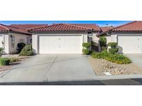 Charming single-story home with a two-car garage and well-manicured landscaping at 450 Intrepid Ct, Boulder City, NV 89005